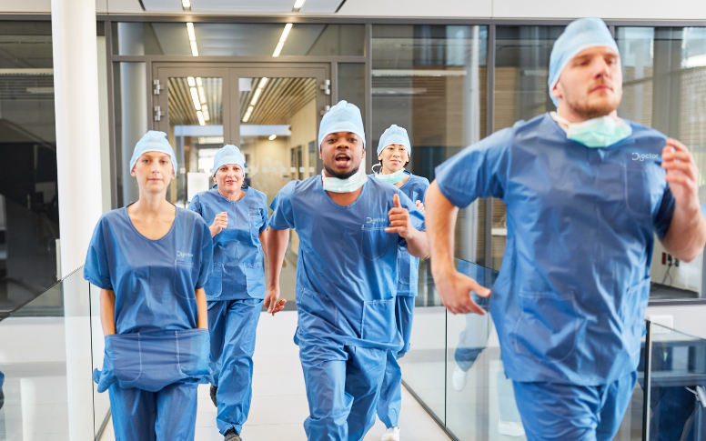 hospital staff running in blue matching scrub sets