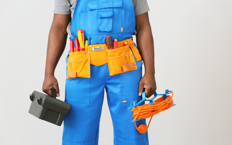 electrician with tool kit in hands